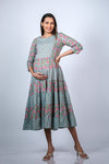 Hands-on-bump view of Blue Floral 3-Layered Maternity Dress, highlighting the comfortable fit and beautiful floral design.