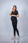 Angled view of Classic Black Ruched Maternity T-Shirt, offering a chic and versatile fit for casual or dressed-up maternity looks.