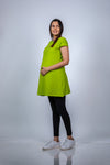 Angled view of Neon Green Fit & Flare Maternity Top, highlighting the flattering fit and ample space for the growing bump.