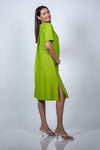 Left-side view of the Neon Green Maternity A-Line T-Shirt Dress with a glimpse of the side slit.