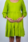 Close-up view of Neon Green Maternity Fit & Flare T-Shirt Dress, highlighting the flattering fit and vibrant color, perfect for a stylish maternity look.
