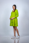 Side view of Neon Green Maternity Fit & Flare T-Shirt Dress, highlighting the comfortable fit and stylish flare design for expecting mothers.