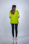 Back view of the Neon Green Maternity T-Shirt, highlighting its relaxed fit and side slits for extra comfort.