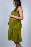 Close-up view of Olive Green Fit & Flare Maternity Dress, showcasing the flattering tiered design and comfortable fit for expecting mothers.