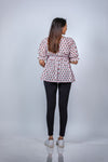 Back view of Pink Floral Delight Fit & Flare Maternity Top, showcasing the relaxed fit and versatile design for casual wear or special occasions.