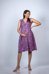 Angled view of the Purple Floral Maternity Fit & Flare Dress, showing the flattering fit and floral print.