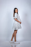 Angled view of Soft Heather Grey Layered Maternity T-Shirt Dress, offering a stylish and comfortable look for expecting mothers.