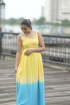 Side view of Sun-Kissed Ombre Maternity Evening Gown, featuring a sleeveless design, scoop neckline, and a comfortable fit for expecting mothers.