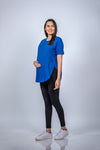 Angled view of Vibrant Blue Maternity T-Shirt, highlighting the flattering and relaxed fit for expecting mothers.