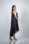 Back view of black maternity layered high-low dress with spaghetti straps, featuring a flowy, layered design for moms-to-be.