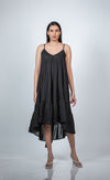 Back view of black maternity layered high-low dress with spaghetti straps, featuring a flowy, layered design for moms-to-be.