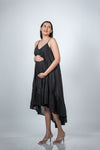 Side view of black maternity layered high-low dress with spaghetti straps, showcasing the elegant high-low hem and flattering fit for moms-to-be.