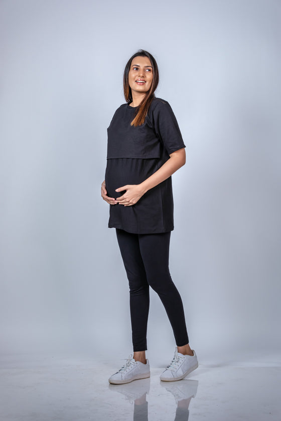 Angled front view of black nursing T-shirt, offering a relaxed fit with functional, discreet nursing access.
