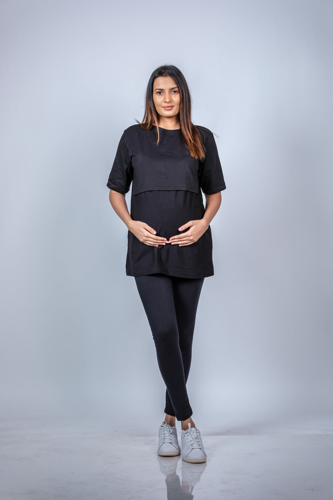  Front view of black nursing T-shirt, featuring a relaxed fit and discreet nursing access for moms-to-be and new mothers.