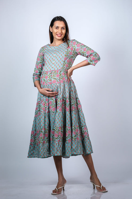 Hands-on-bump view of Blue Floral 3-Layered Maternity Dress, highlighting the comfortable fit and beautiful floral design.
