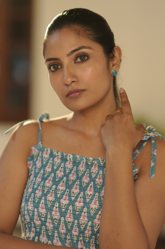 Close-up of Blue Printed Maternity Tie-Strap Evening Gown, highlighting the charming tie-strap details for a touch of playful elegance and comfort.