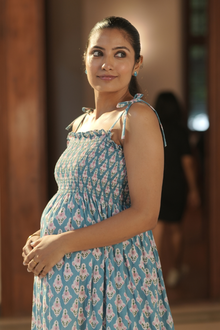  Front view of Blue Printed Maternity Tie-Strap Evening Gown, featuring tie-strap details for adjustable comfort and a flattering fit for moms-to-be.