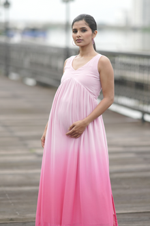  Front view of Blush Ombre Maternity Evening Gown, featuring a sleeveless design and soft pink gradient for a comfortable and elegant fit.