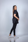 Angled view of the Classic Black Maternity T-Shirt, offering a flattering silhouette for expecting mothers.