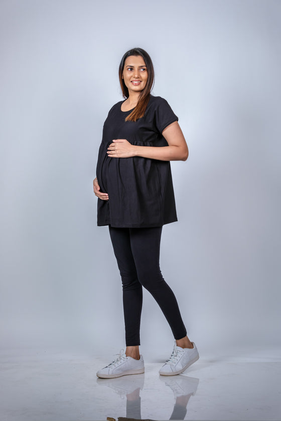 Angled view of the Classic Black Maternity T-Shirt, highlighting the chic and comfortable silhouette for expecting mothers.