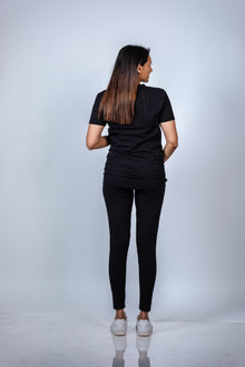  Back view of Classic Black Ruched Maternity T-Shirt, showcasing the timeless design and comfortable fit for expecting moms.