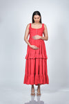 Close-up view of Coral Red Maternity Layered Sleeveless Buttoned Maxi Dress, highlighting the intricate button detailing and soft fabric.