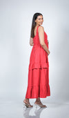 Side view of Coral Red Maternity Layered Maxi Dress, emphasizing the flowy, comfortable fit over the growing bump.