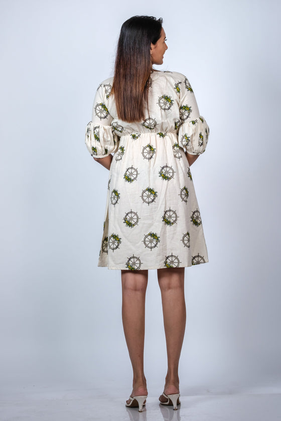 Back view of Cream Floral Maternity Fit & Flare Puff Sleeve Dress, highlighting the flowy and comfortable fit with puff sleeves and floral design.