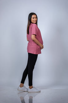  Side view of Dusty Rose Maternity T-Shirt, featuring a comfortable and relaxed fit with ample space for the growing bump.