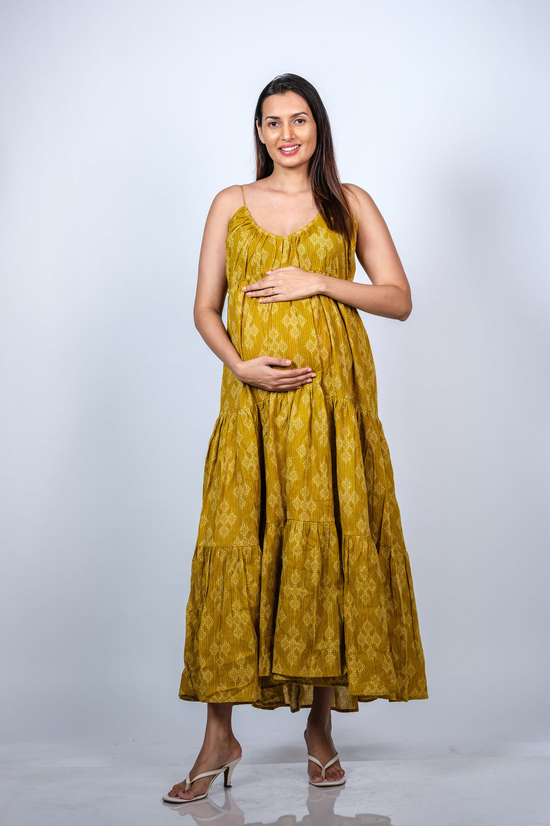  Front view of Mustard Yellow 3-Layered Maternity Dress showcasing a flowy design with adjustable spaghetti straps, perfect for moms-to-be.