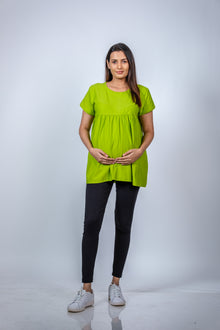  Front view of Neon Green Babydoll Maternity T-Shirt, showcasing a relaxed fit and vibrant color for moms-to-be.