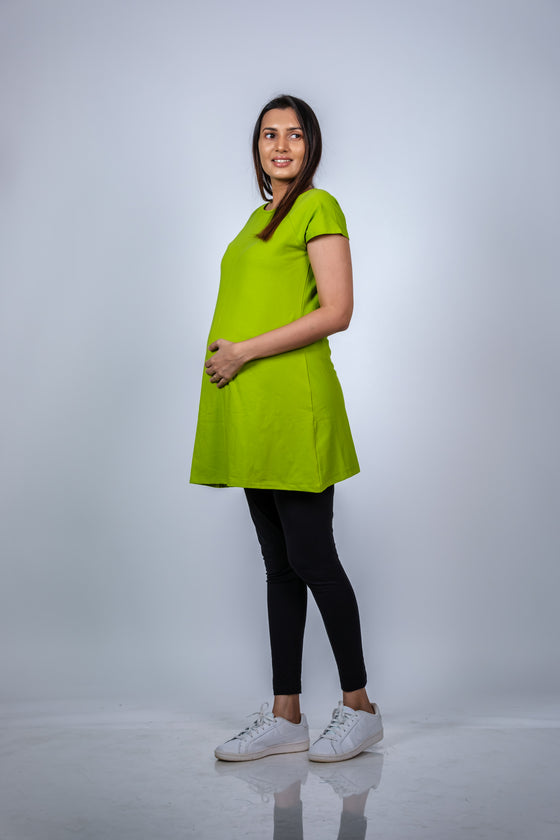 Angled view of Neon Green Fit & Flare Maternity Top, highlighting the flattering fit and ample space for the growing bump.