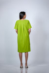 Back view of the Neon Green Maternity A-Line T-Shirt Dress, featuring a relaxed fit for ultimate comfort.