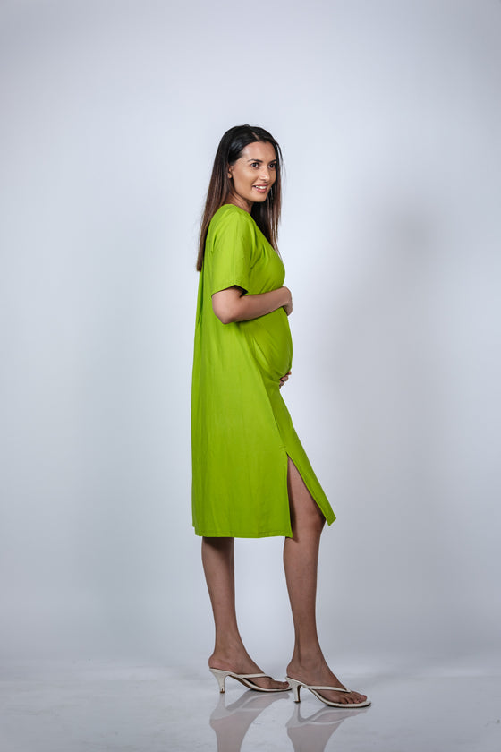 Close-up view of the side slit on the Neon Green Maternity A-Line T-Shirt Dress, adding a stylish touch.