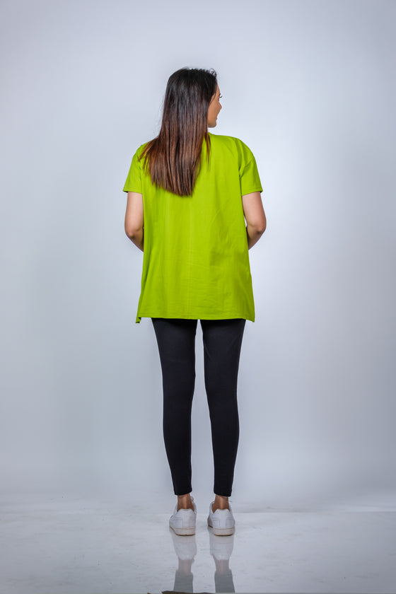 Back view of the Neon Green Maternity T-Shirt, highlighting its relaxed fit and side slits for extra comfort.