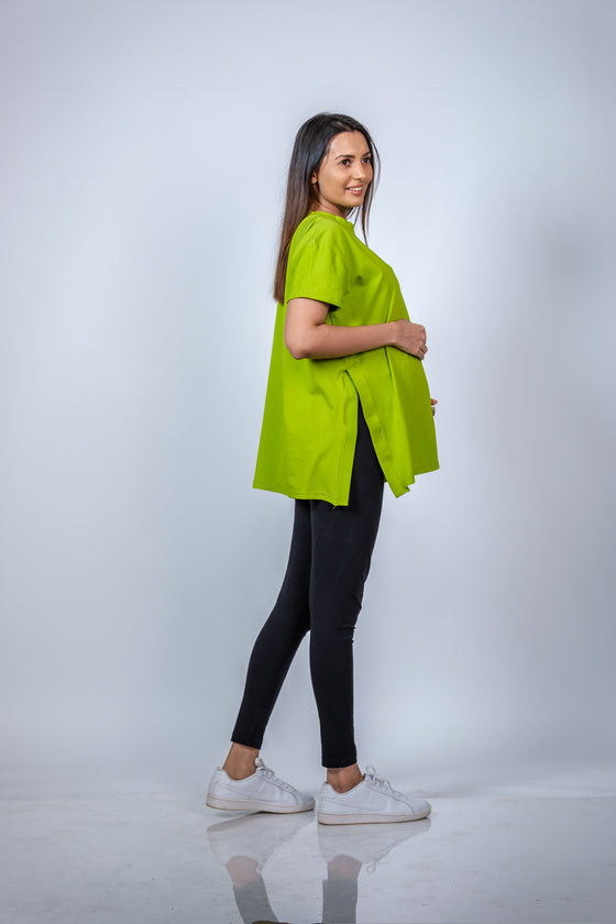 Side view of the Neon Green Maternity T-Shirt, showcasing its breathable fabric and versatile style for casual outings.