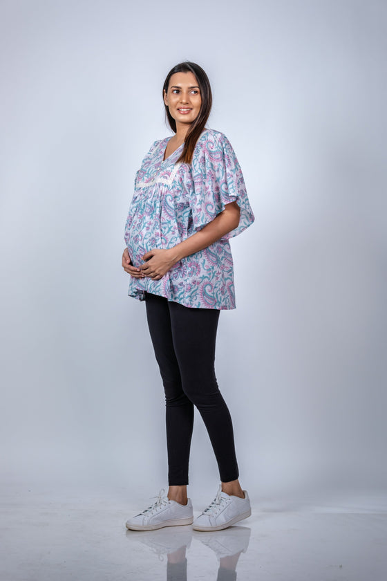Angled view of Pastel Paisley Fit & Flare Maternity Top, highlighting the flattering fit and ample room for the growing bump.
