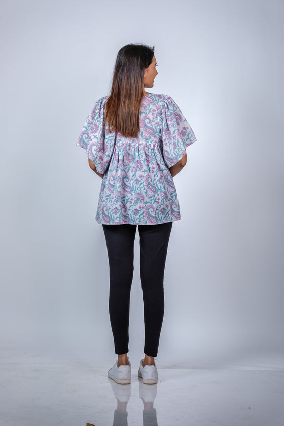 Side view of Pastel Paisley Fit & Flare Maternity Top, offering a flowy, relaxed fit for expecting moms.