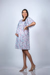 Angled view of Pastel Paisley Maternity Fit & Flare Flutter-Sleeve Dress, highlighting the fit and elegant design.