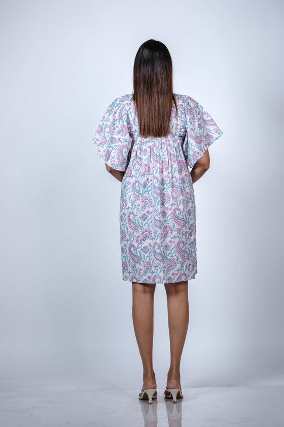 Back view of Pastel Paisley Maternity Fit & Flare Flutter-Sleeve Dress, featuring the flowy silhouette and soft, breathable fabric.