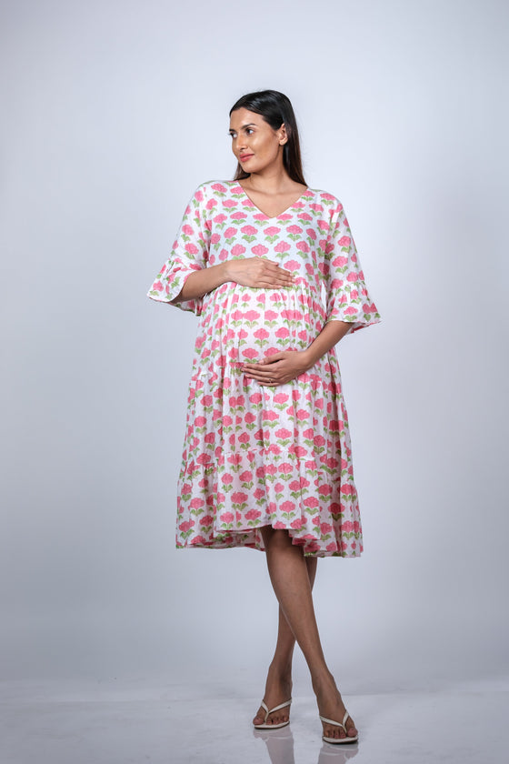 Front view of the Pink Floral Maternity Fit & Flare Bell-Sleeve Dress, showcasing the flattering fit for expecting moms.