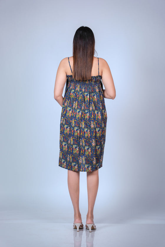 Back view of the Printed Frill Maternity Midi Dress, featuring the adjustable spaghetti straps and vibrant print.