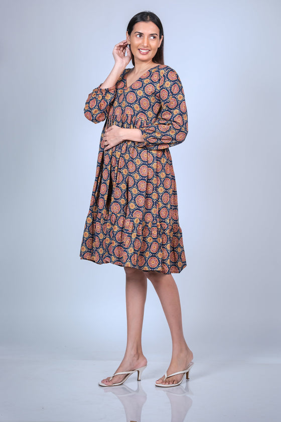 Side view of printed maternity fit & flare dress featuring balloon sleeves and a comfortable silhouette, perfect for pregnancy wear.