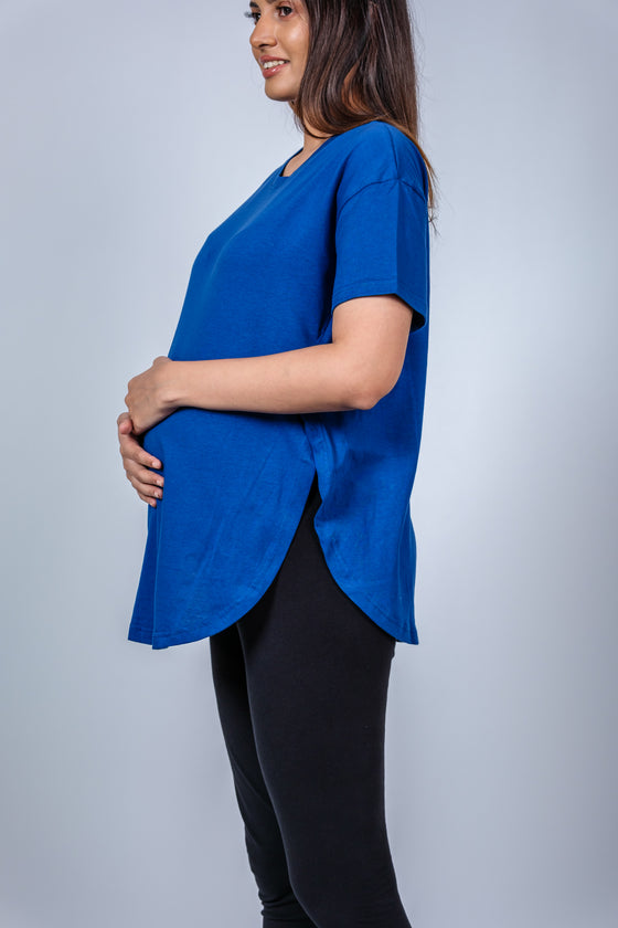 Close-up view of Vibrant Blue Maternity T-Shirt, highlighting the flattering fit and room for a growing bump.