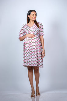  Front view of White Floral Fit n' Flare Maternity Dress, showcasing a comfortable and stylish fit for moms-to-be.