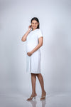 Angled view of White Maternity A-Line T-Shirt Dress, showing the relaxed and chic style for casual outings.