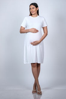  Front view of White Maternity A-Line T-Shirt Dress, showcasing a comfortable and casual fit for moms-to-be.